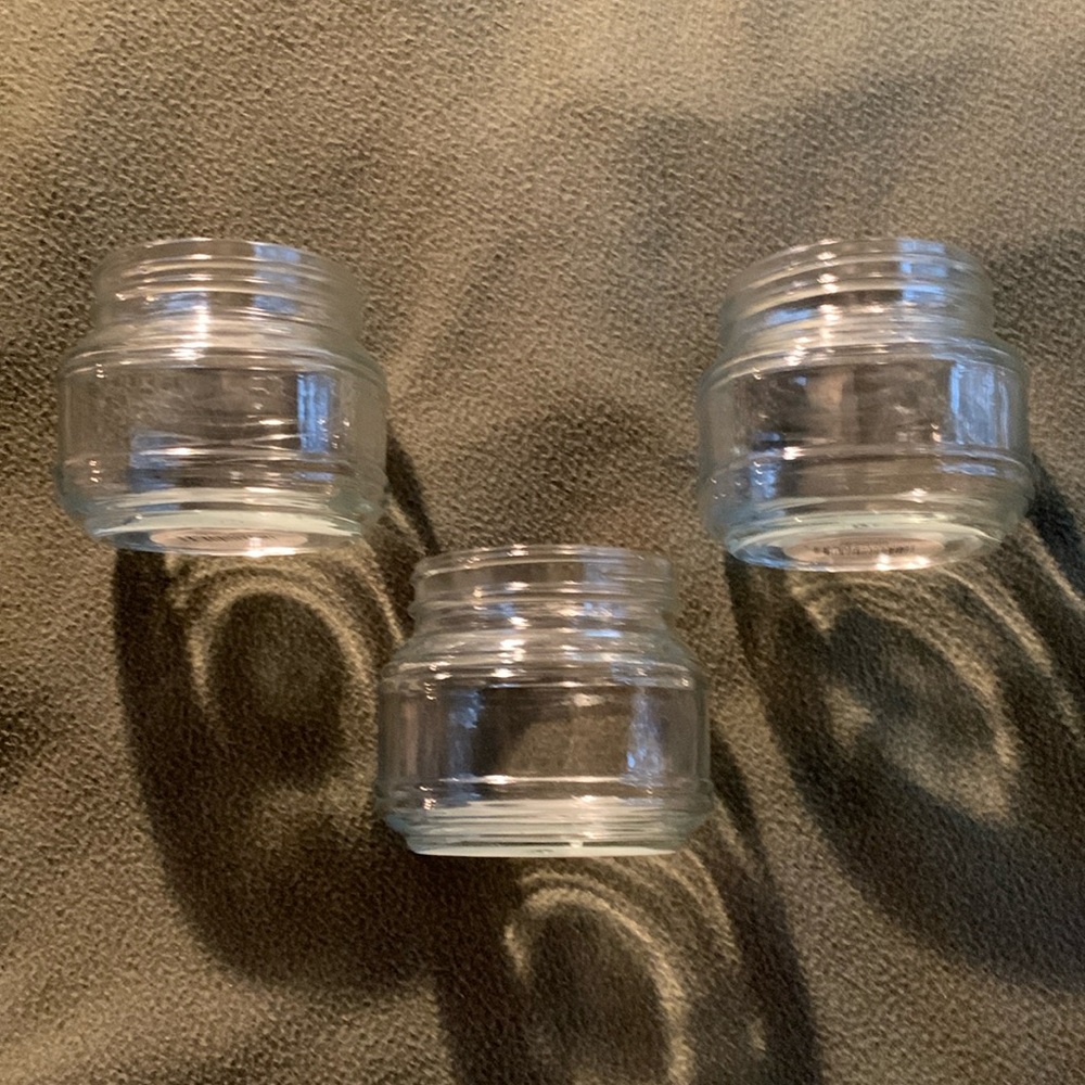 New Candle-lite clear glass candle holders. Set of 3. Approx 3 1/2” x 3 1/3”